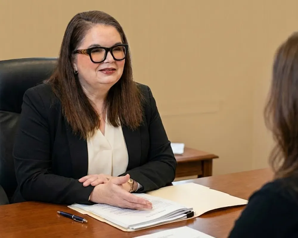 Kelly M. Curro, Esq. consulting a client on divorce representation in Saratoga County